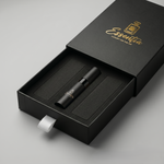 BlackEssentia vape device in a branded box on a gray background