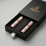 two lip glosses in a black box with 'Essentia' branding on a gray background