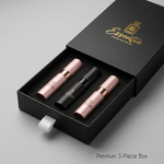 Three lip glosses in a black box with 'Essentia' branding on a gray background