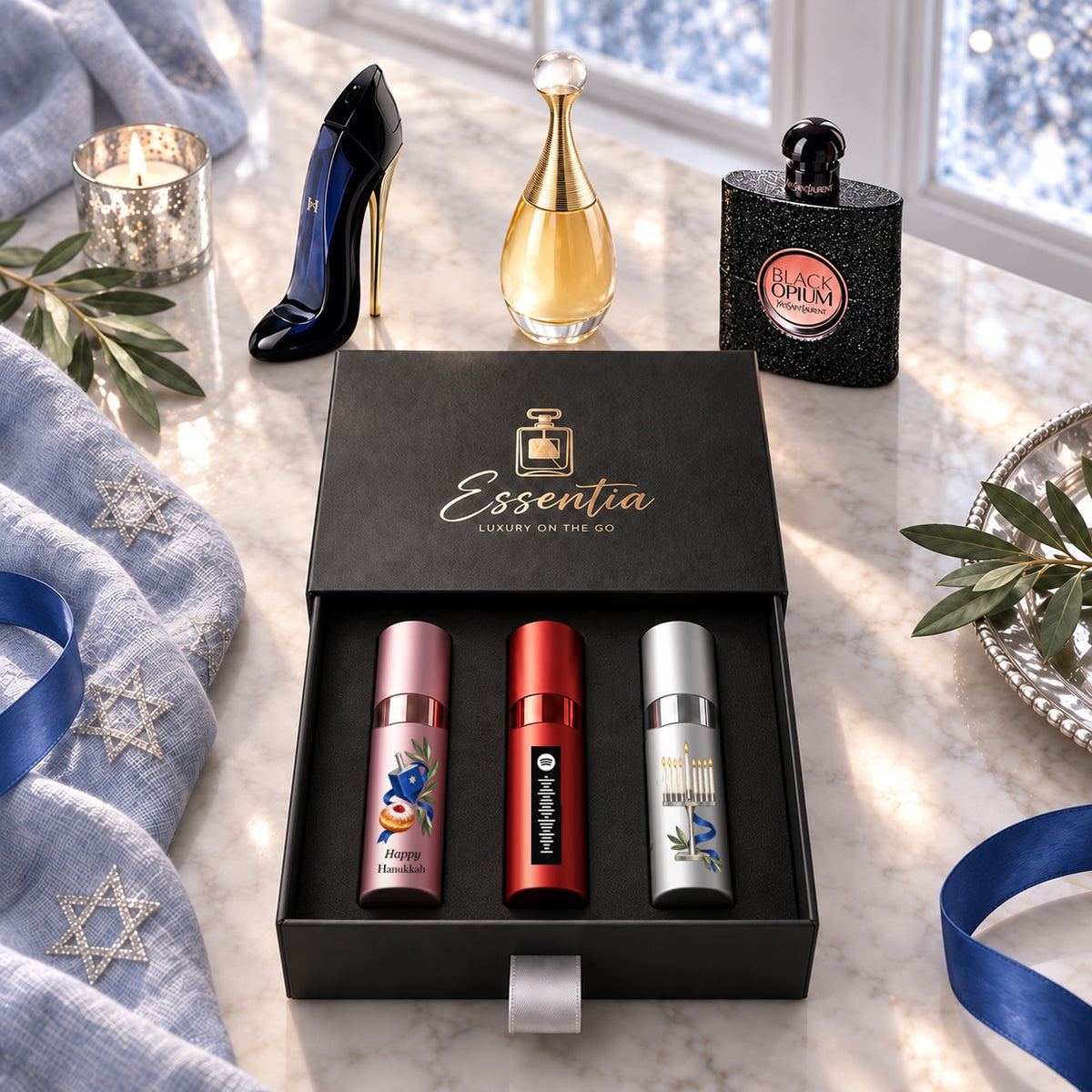 Hanukkah Fragrance Gift Set for Her — hero. Original black Happy Hanukkah lettering on the pink atomizer and aligned shared motif.