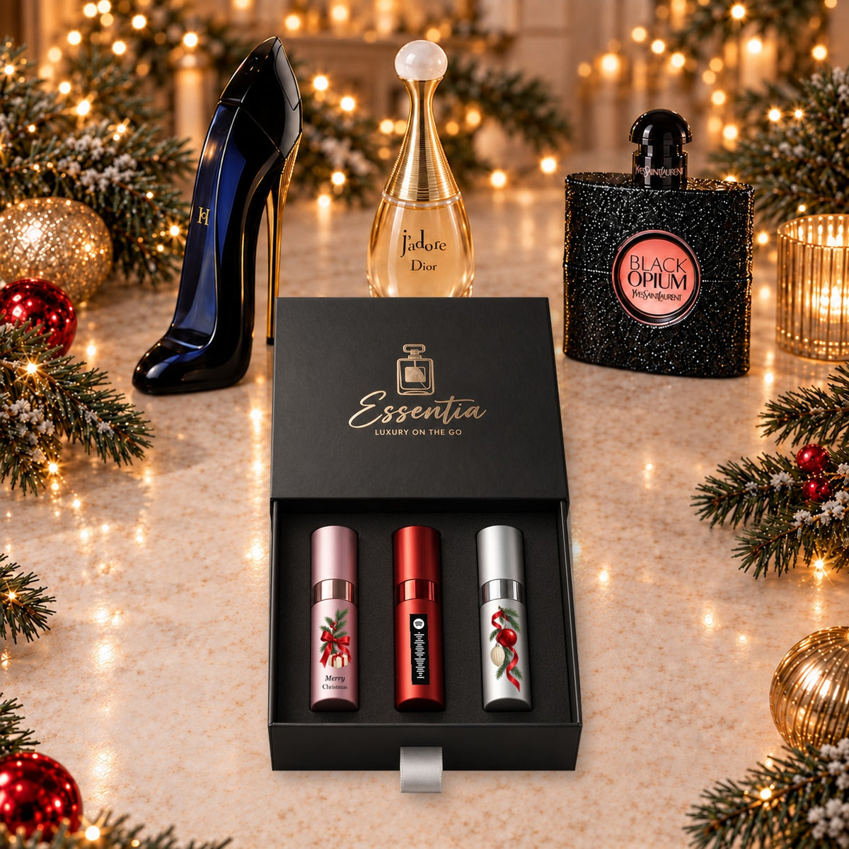 Christmas Fragrance Gift Set for Her — hero. Pink, red and silver atomizers with Christmas artwork in the Essentia gift box.