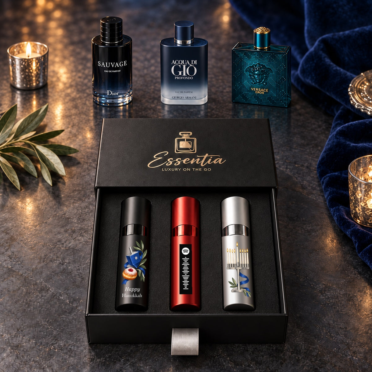 Hanukkah Fragrance Gift Set for Him — hero. Black, red and silver atomizers with Hanukkah artwork in the Essentia gift box.