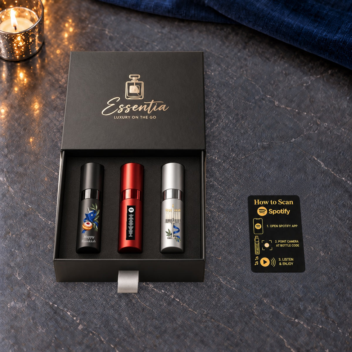 Hanukkah Fragrance Gift Set for Him — included contents. Black, red and silver atomizers with Hanukkah artwork in the Essentia gift box.