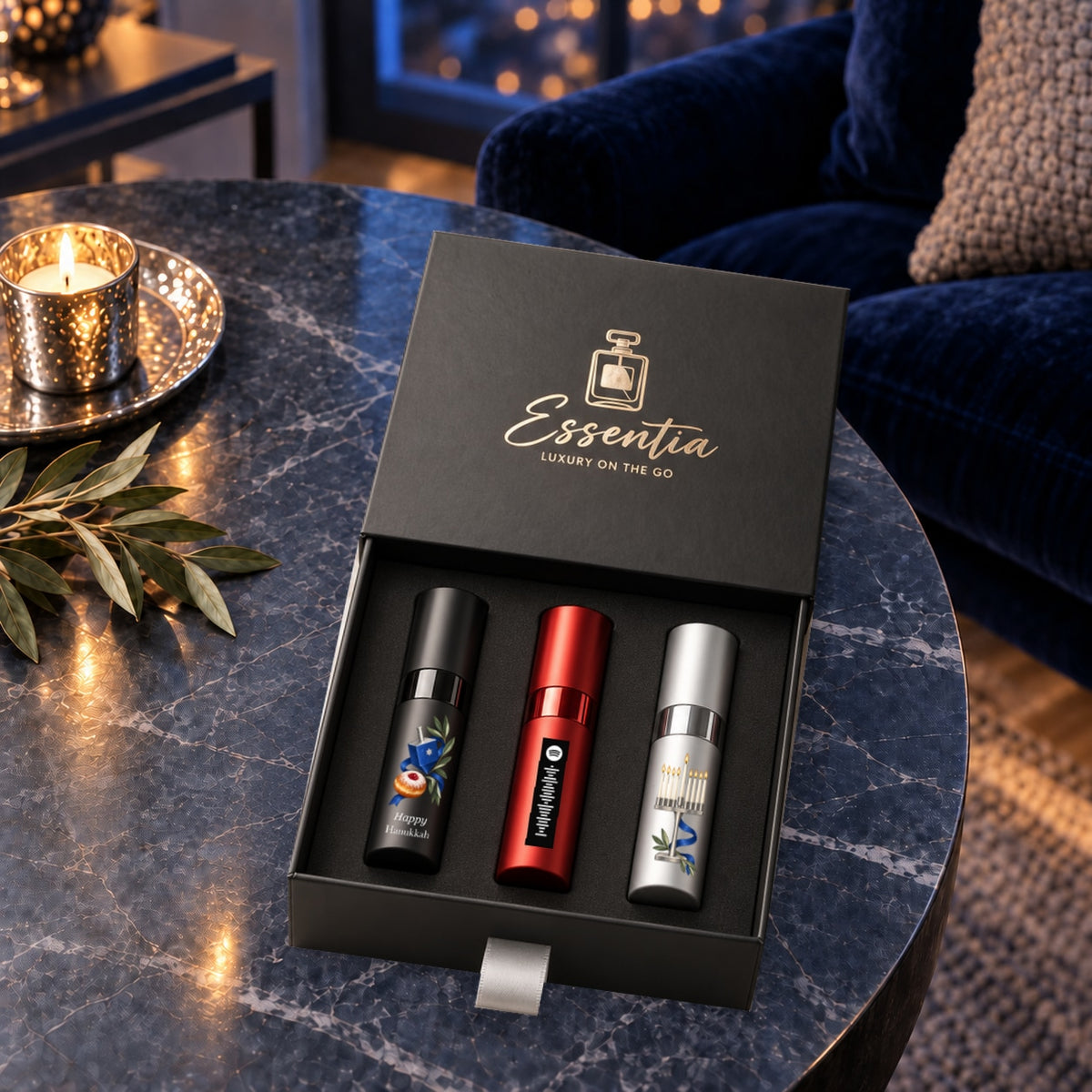 Hanukkah Fragrance Gift Set for Him — lifestyle. Black, red and silver atomizers with Hanukkah artwork in the Essentia gift box.